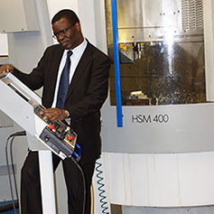 A researcher operating the Mikron HSM 400