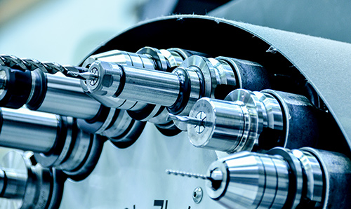 Close-up of metallic drill bits on machine