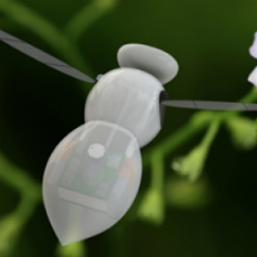 Close up of a tiny white robot in the shape of a bee