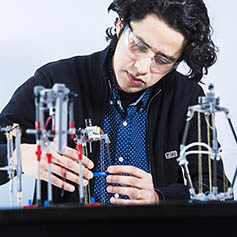 Researcher operating prototypes for jumping robots
