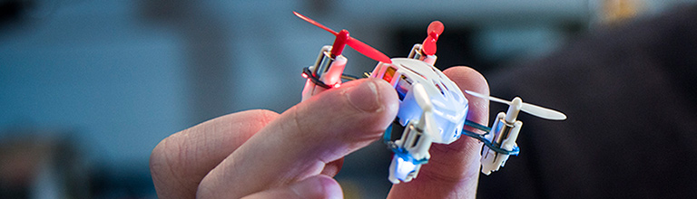 hand of a student holding a small drone