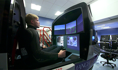 Undergraduate using flight simulator